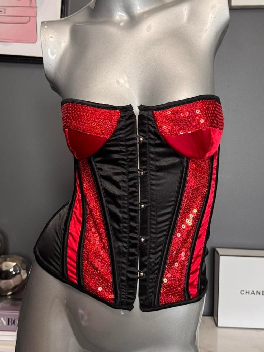 Coquette Brand Red/black corset top with lace up back and sequin details.